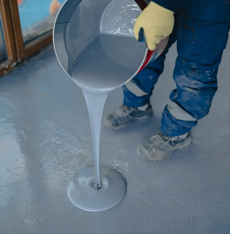 Tile adhesive being applied with a notched trowel